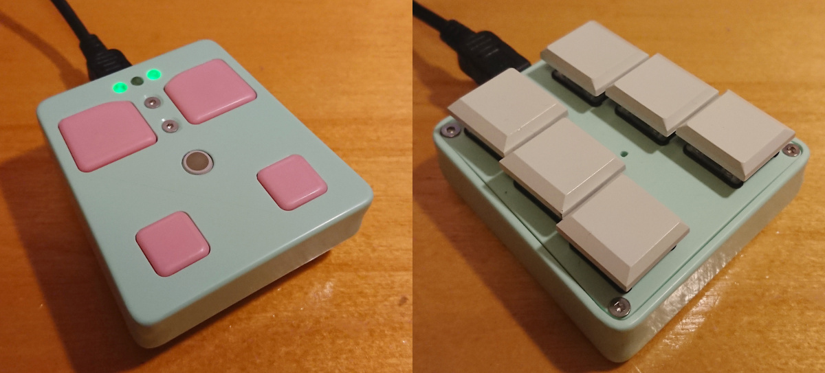 a mint green 3d printed wedge shaped controller with four pink mouse buttons on one side and six white keycapped mechanical switches in two columns on the other